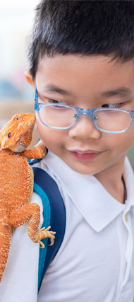 Student with a classroom lizard